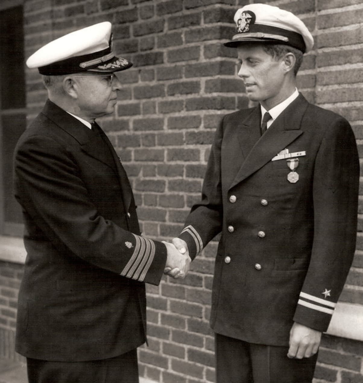 Future president John F. Kennedy receives the Navy and Marine Corps medal for Gallantry in Action, June 1944. 